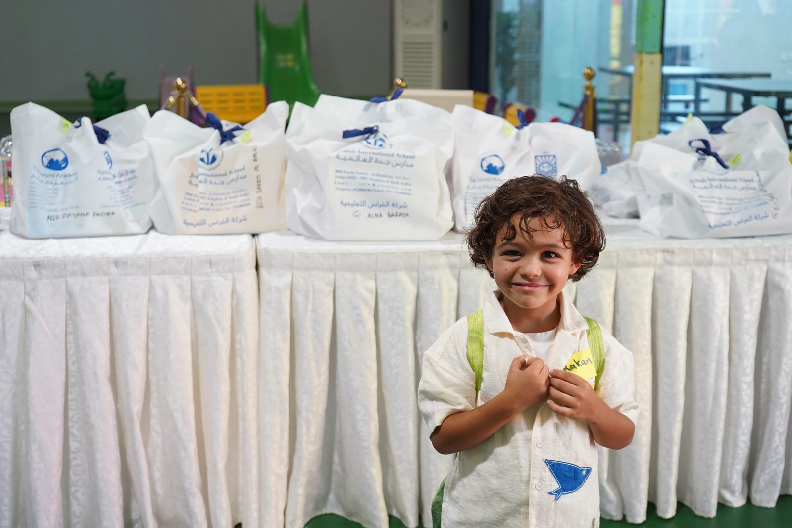 Student in front of the welcome packs